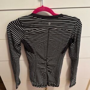 Lululemon on long sleeve exercise top. Breathable material in armpits into back.